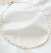 Freshwater pearl necklace styled on fabric, Luna, styled view — Lemonberry Aurora