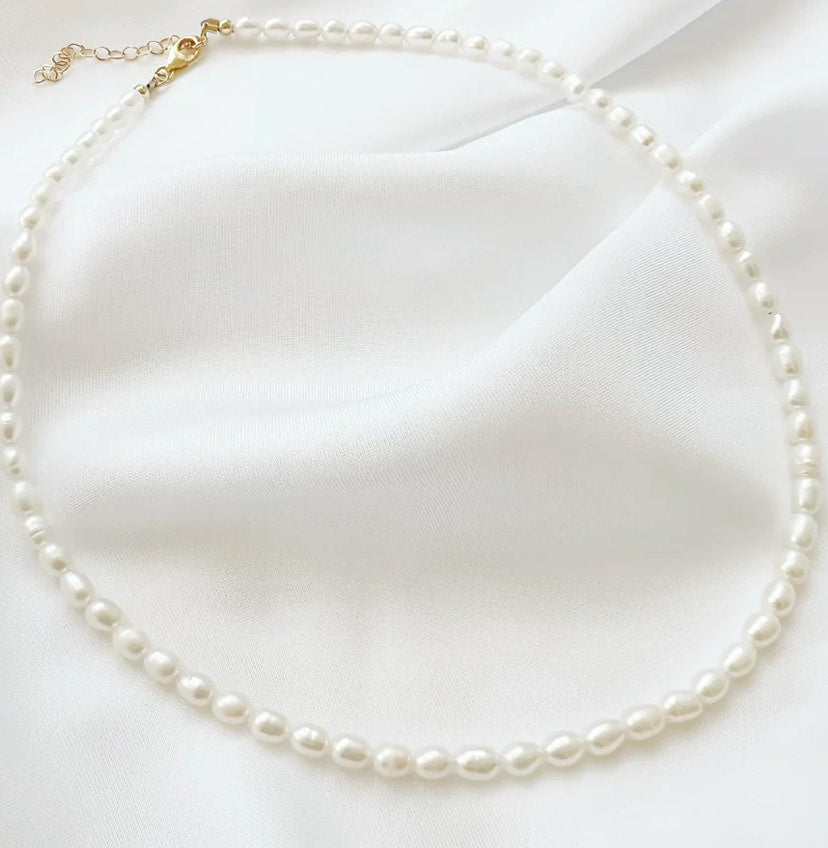 Freshwater pearl necklace styled on fabric, Luna, styled view — Lemonberry Aurora
