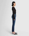 Full side view of model wearing Daisy Ankle Boot by 7 For All Mankind, available at Lemonberry.