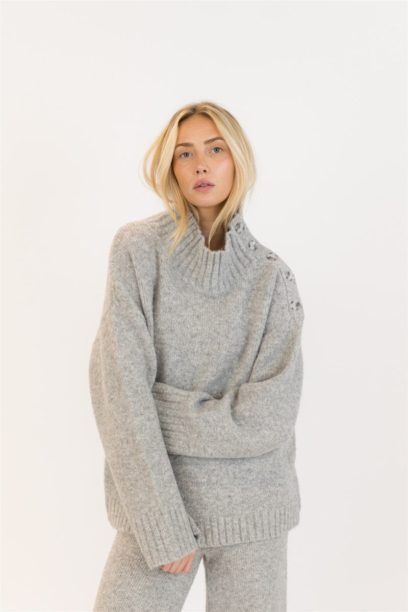 Front view of woman in GANTLUXE Heather Grey sweater and pants set, studio background