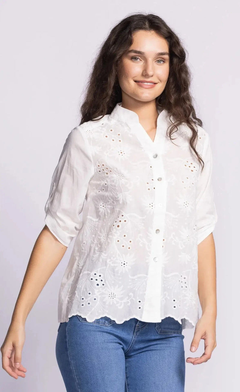 A front view of the Garcella blouse worn with blue denim at Lemonberry