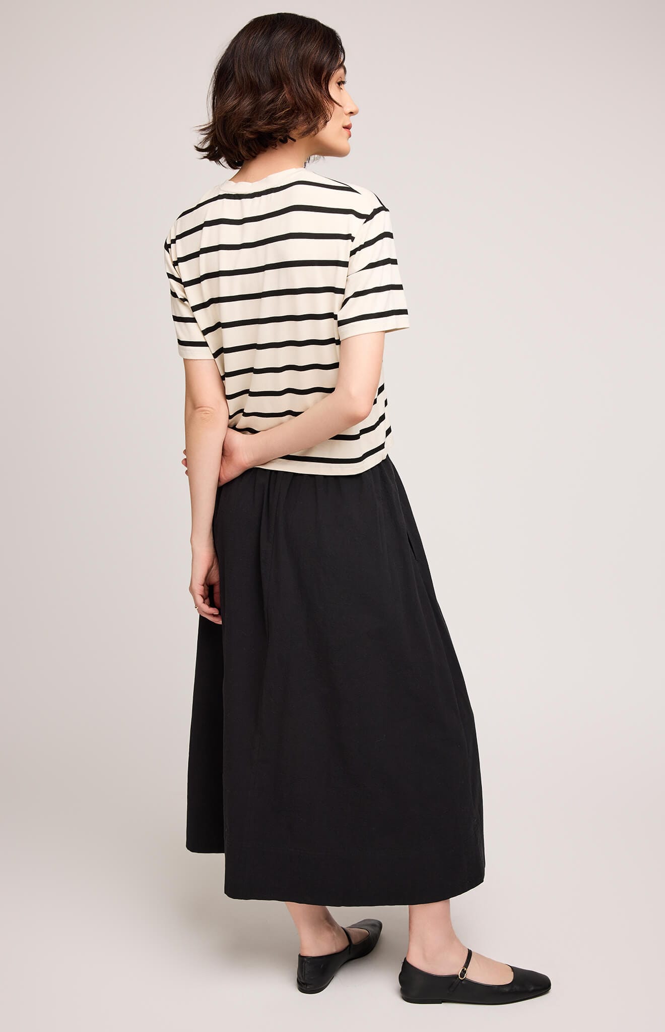 Back view of Gentle Fawn Geneva Skirt in black, showing full midi length.