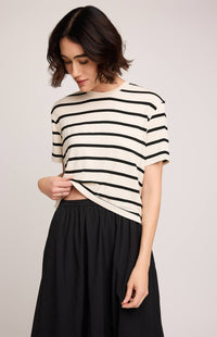 Gentle Fawn Geneva Skirt in black paired with striped top, side view showing waistband detail.