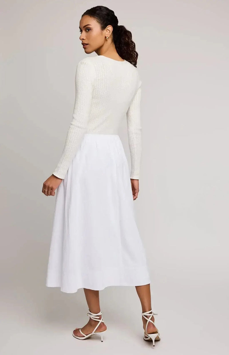 Model wearing the Geneva skirt by Gentle Fawn, turned around to show the back side of the skirt.