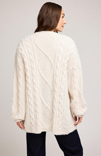 Back view of Gentle Fawn Betty Cardigan in cream, showing cable knit diamond pattern.

