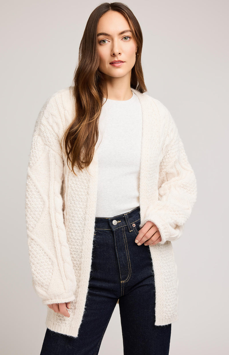 Close-up of Gentle Fawn Betty Cardigan in cream showing cable knit detail and rolled sleeve hem.