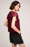 Side view of Gentle Fawn Carlotta blouse in rich wine colour, close-up of neckline