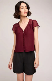 Gentle Fawn Carlotta blouse in burgundy with sheer sleeves, styled with black shorts – Lemonberry, Aurora ON