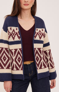 Close-up of the Gentle Fawn Dorian cardigan in Navy showing its cream and burgundy geometric knit