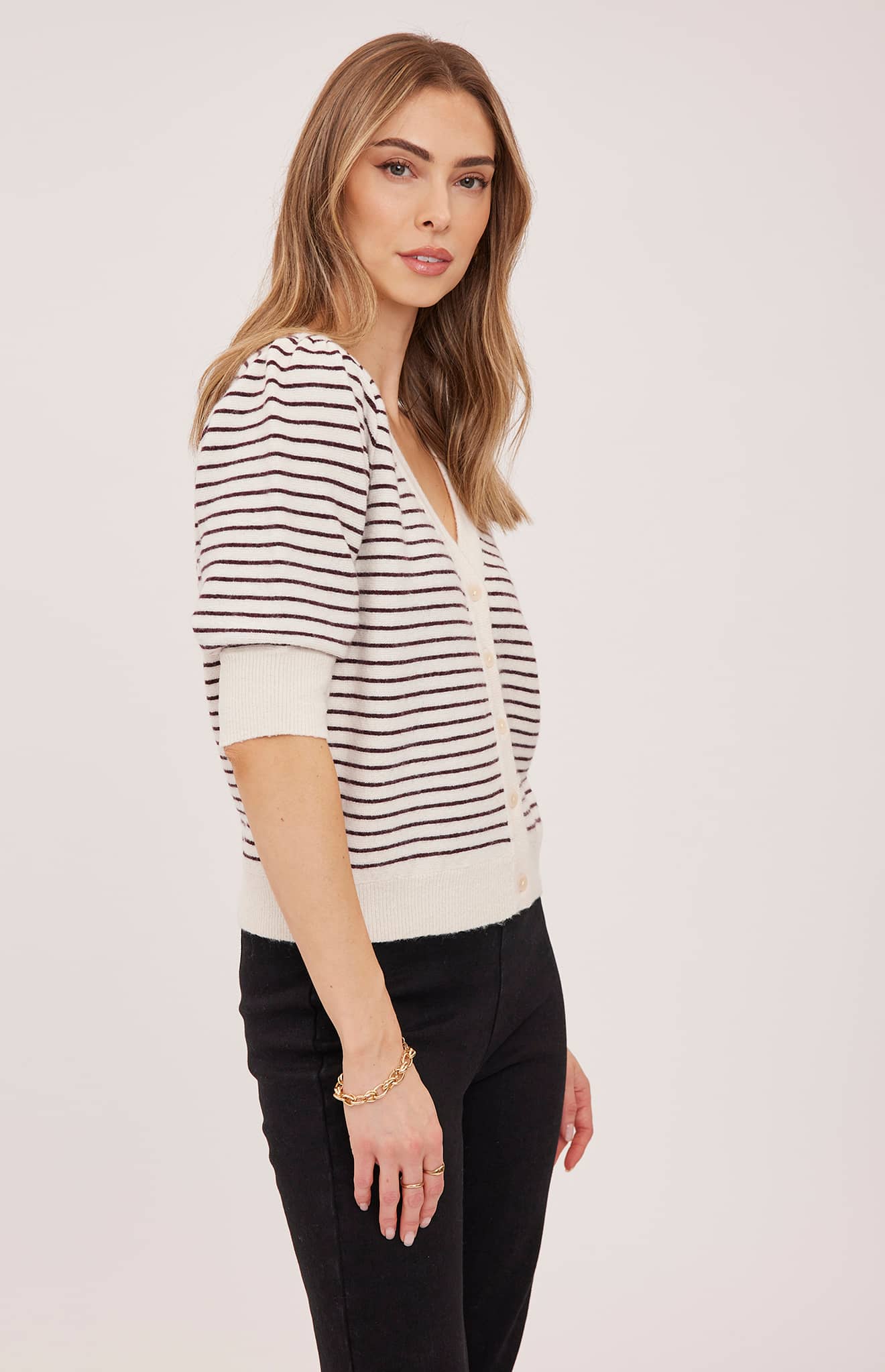 Side view of the Gentle Fawn Hildi cardigan in Fig Stripe showing its puff sleeves and relaxed fit