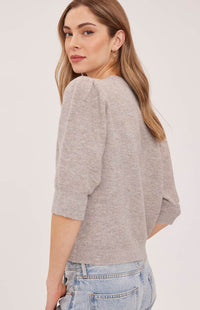Back view of the Gentle Fawn Hildi cardigan in Heather Latte showing its puff sleeves and soft knit