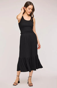 Full-body view of model wearing the Gentle Fawn Layla Tank and Elaine Skirt in black. A chic, coordinated set with a textured knit finish.