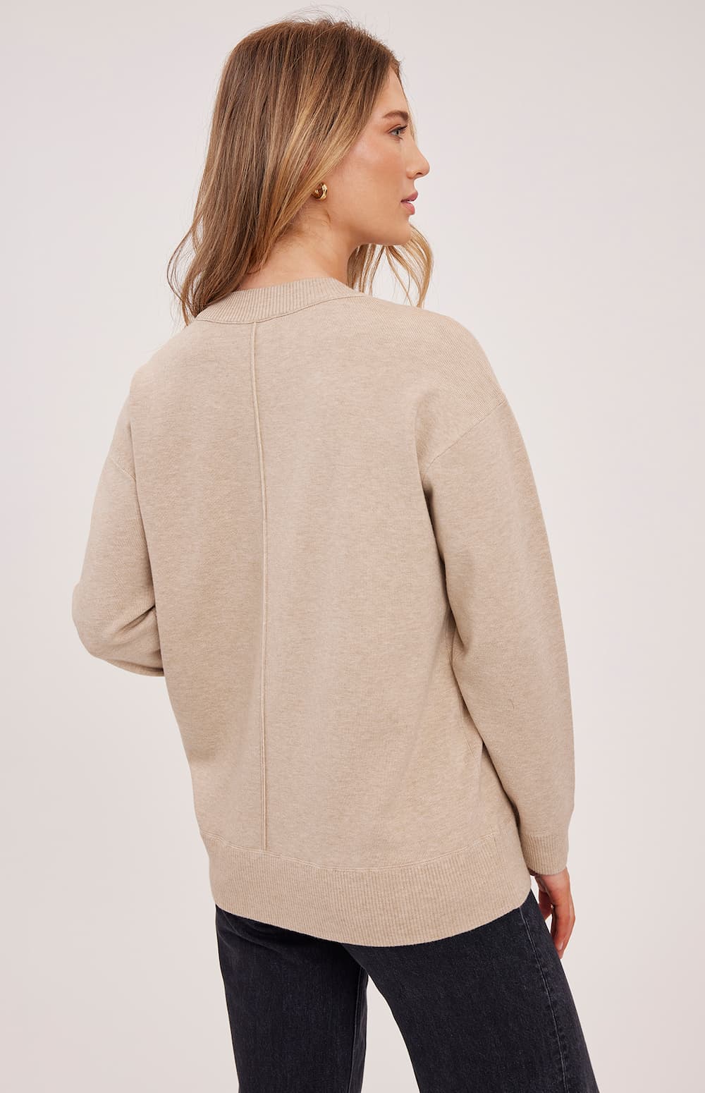 Back view of Gentle Fawn Louella knit sweater in soft heather oat