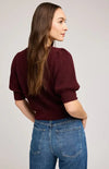 Back view of burgundy Phoebe sweater showing slim fit and puff-sleeve detail