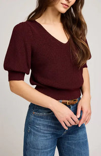 Side view of model in burgundy Phoebe sweater with V-neckline and puff sleeves – Gentle Fawn