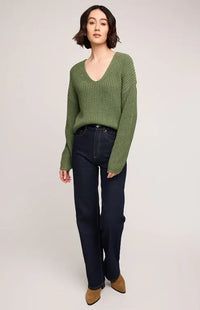 Front view of Gentle Fawn Spencer Sweater in olive green with V-neck and relaxed fit—styled with jeans at Lemonberry.