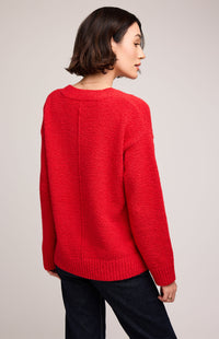 Back view of Gentle Fawn Tilda Sweater in red, showing jersey knit pattern and ribbed hem.