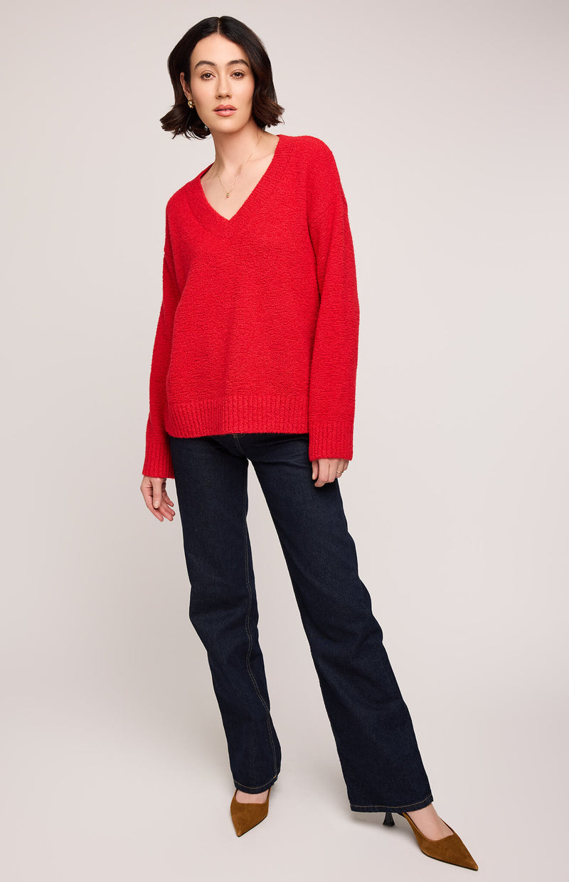 Front view of model wearing Gentle Fawn Tilda Sweater in red, styled with dark jeans and brown heels – Newmarket The Maids’ Cottage reference.