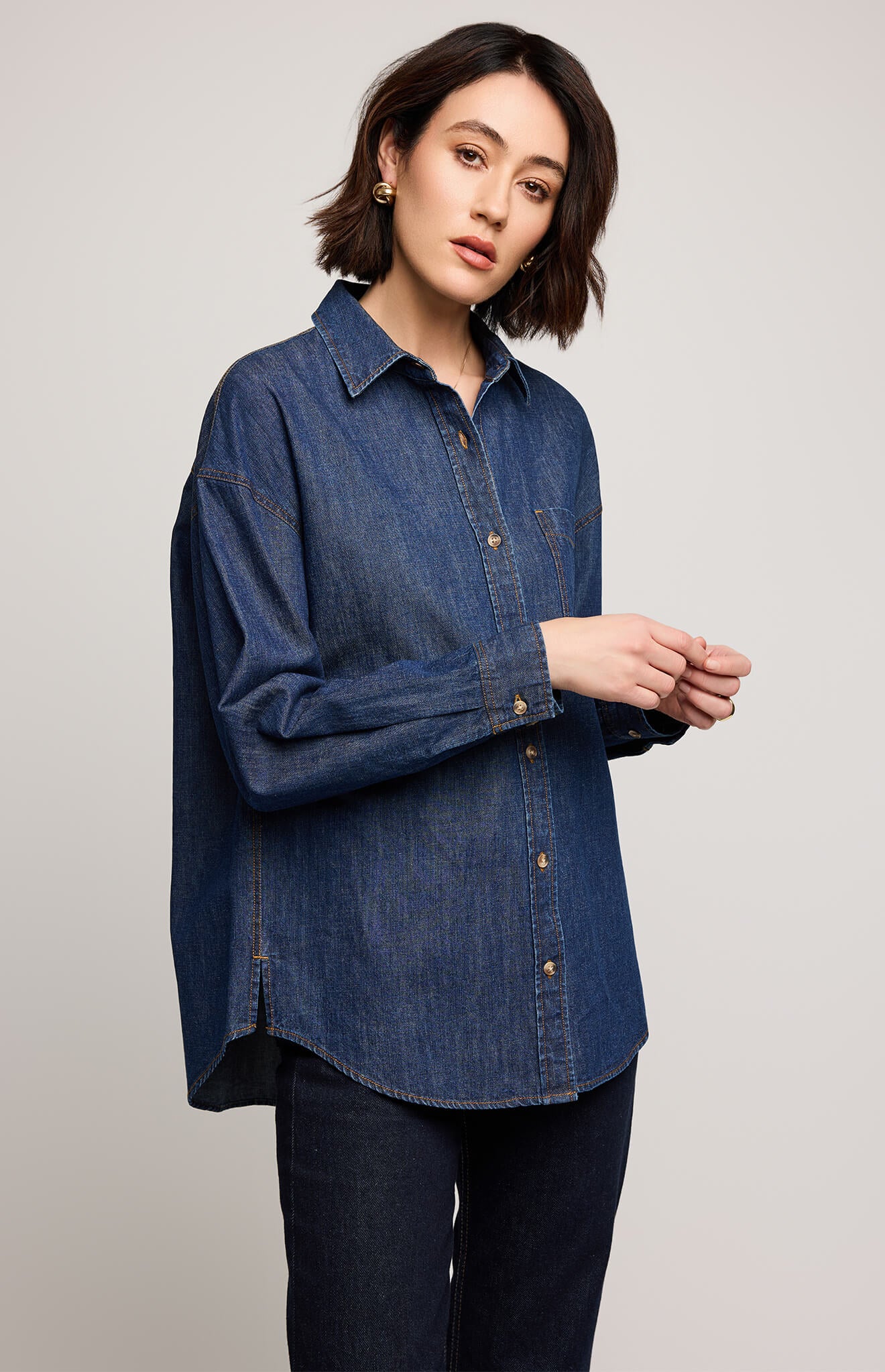 Gentle Fawn Whitney Denim Button Down Shirt in dark wash, side view showing slit detail, available at Lemonberry