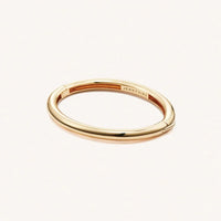 Gold Gia bangle by Jenny Bird on a white background at Lemonberry in Aurora