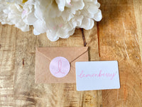 Lemonberry gift card with eco-friendly envelope, available online and in-store in Aurora, ON.