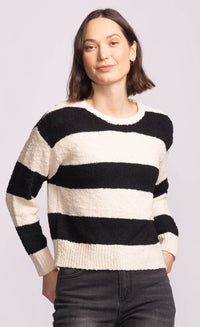 Front angled view of Pink Martini Glynn Sweater, black and white striped knit, versatile everyday Toronto fashion.