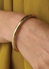 Close up of the gold Gia bangle by Jenny Bird