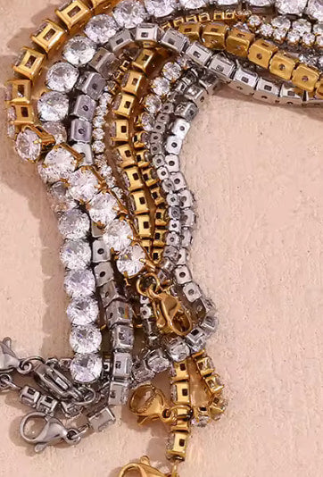 Close up of gold and silver stainless steel tennis bracelets showing lobster clasp and zircon setting Lemonberry Aurora
