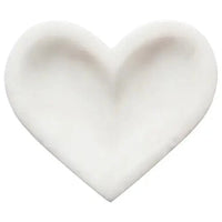 Overhead view of white marble heart dish by Danica Studio