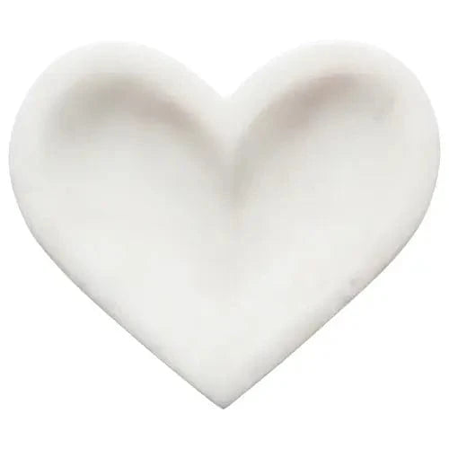 Overhead view of white marble heart dish by Danica Studio
