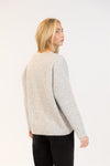 Back view of grey Lyla & Luxe sweater showing relaxed fit