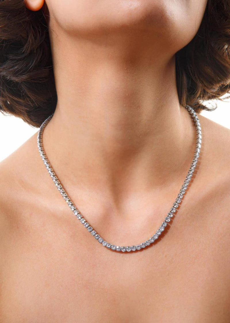 Hoopla silver tennis necklace worn close to neckline on model Lemonberry Aurora