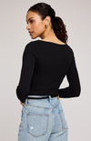 Back view of Ingrid top in black showing neckline – styled casually with jeans