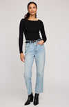 Front view of Ingrid top by Gentle Fawn in black, paired with denim and boots – Newmarket