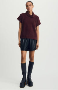 Jack Sweater in rich merlot styled with faux leather shorts, studio background.