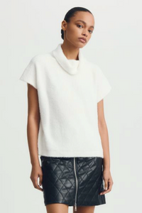 White Jack Sweater styled with a quilted zip-up mini skirt, cropped shot.