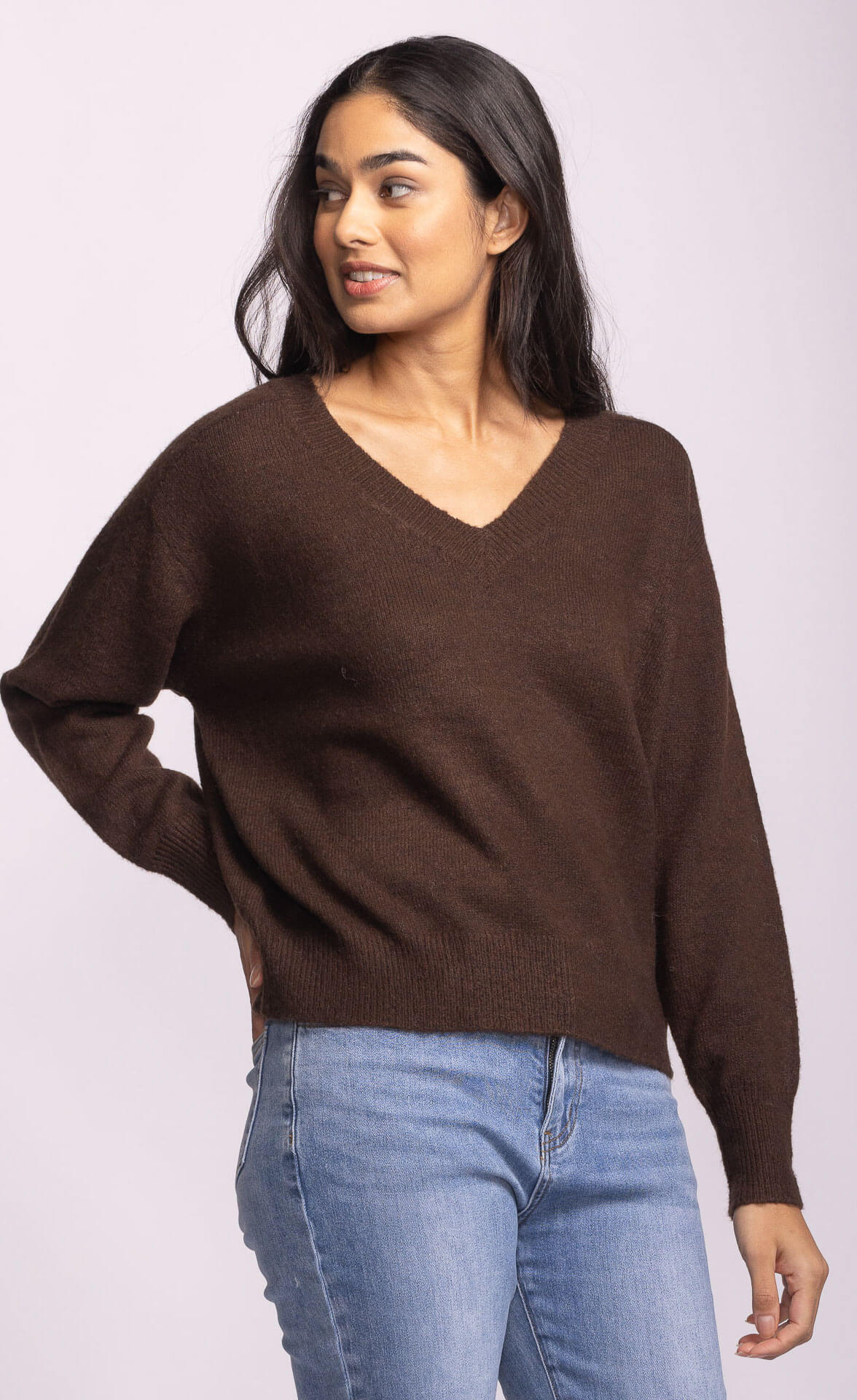 Side profile of the Jacon Sweater in brown, relaxed drape with v-neckline