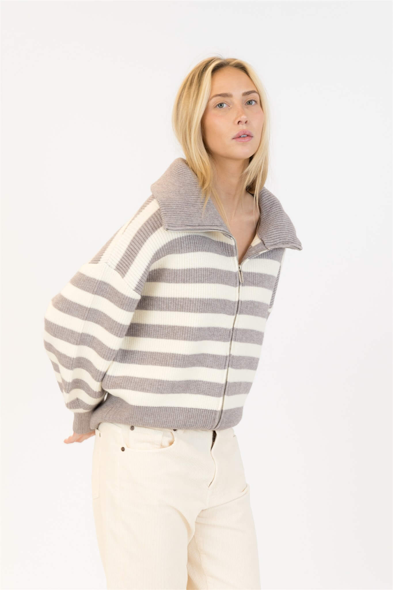 Side view of Lyla & Luxe James Sweater with wide collar and zip front