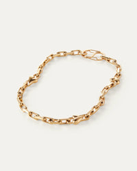Jenny Bird Art Heart Chain Necklace in high-polish gold, flat lay on neutral background