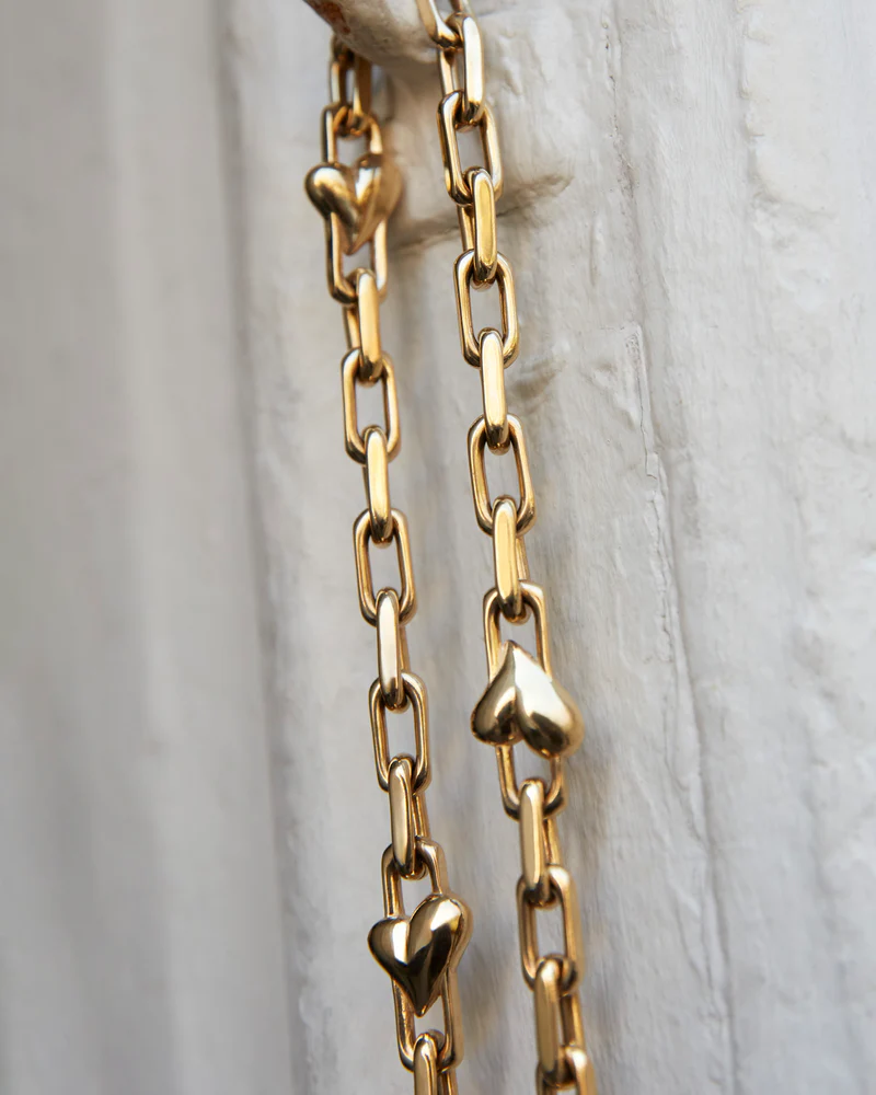 Close-up of sculpted heart link detail on Jenny Bird Art Heart Chain Necklace