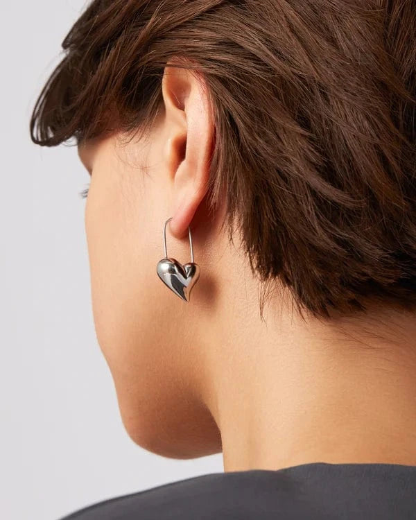 Silver Heart Earrings worn on model ear, Lemonberry Aurora.