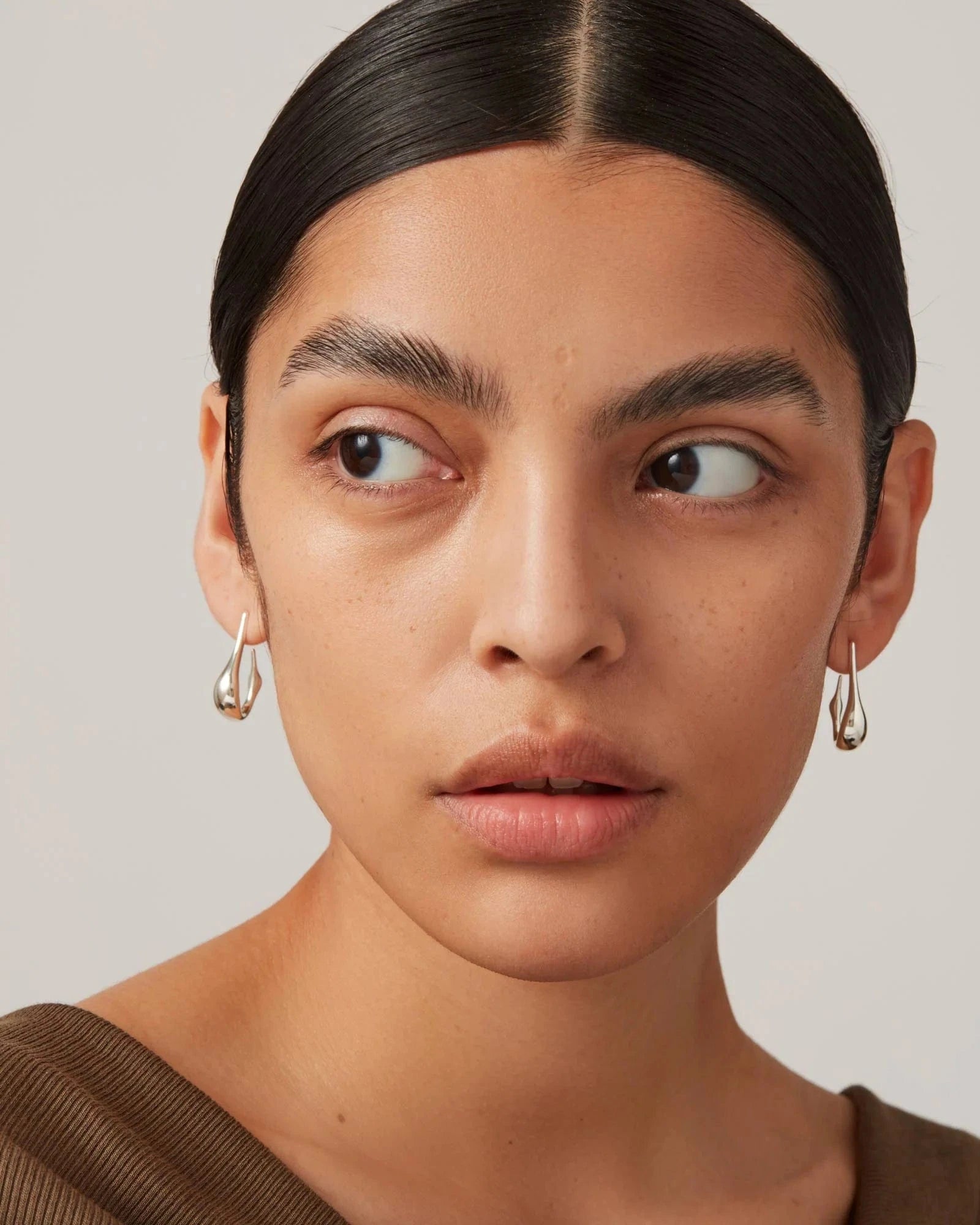 Jenny Bird Colette Hoop Small in silver — front view on model, Lemonberry Aurora.