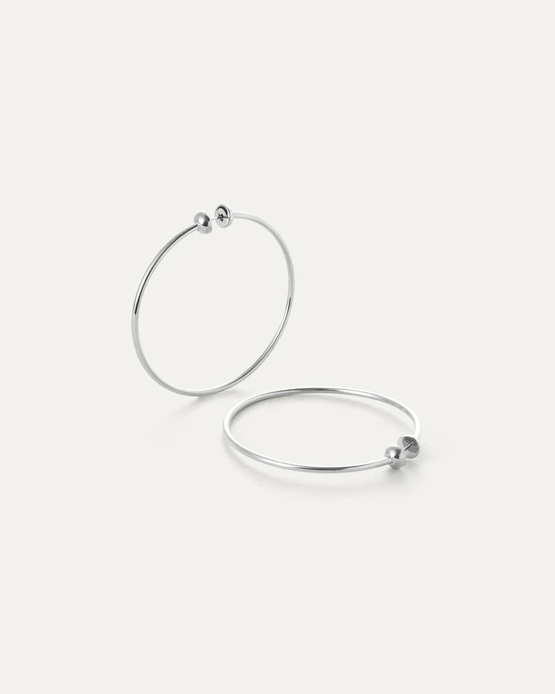 Jenny Bird Icon Hoops Medium silver displayed as a pair with clean minimalist finish