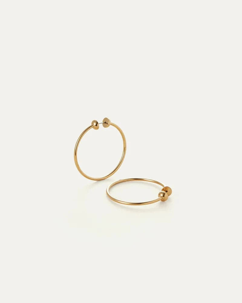 Jenny Bird Icon Hoops Small in gold – minimalist gold hoop earrings on white background, Lemonberry Aurora – polished everyday jewelry.