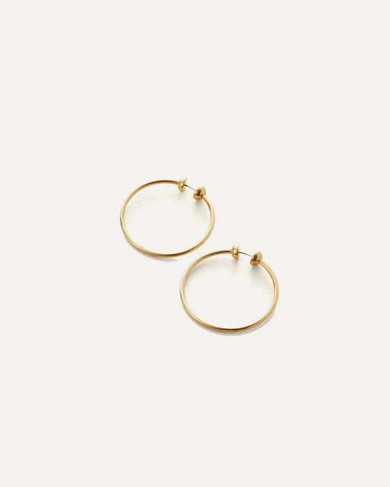 Jenny Bird Icon Hoops Small in gold — flatlay on white surface, Lemonberry Aurora — minimalist jewelry styling.