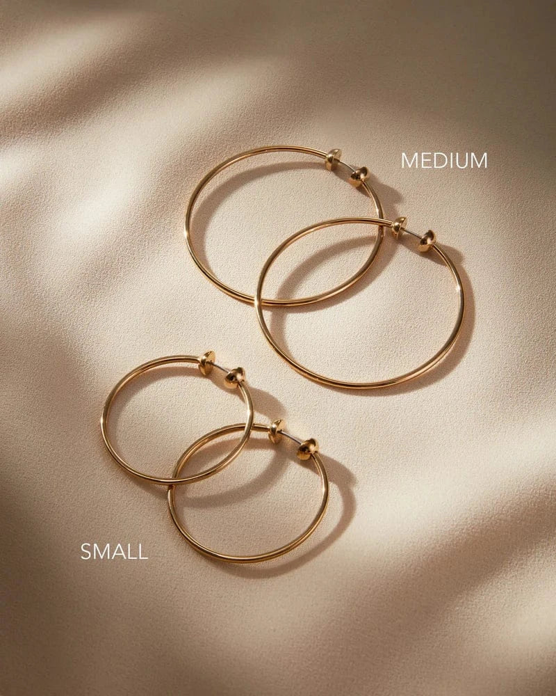 Jenny Bird Icon Hoops Small and Medium side by side on neutral fabric, Lemonberry Aurora — size comparison flatlay.
