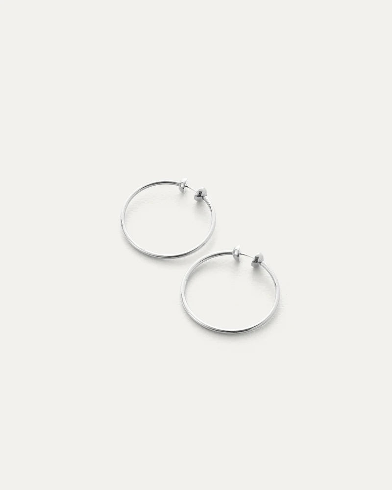 Pair of silver hoop earrings on a white background