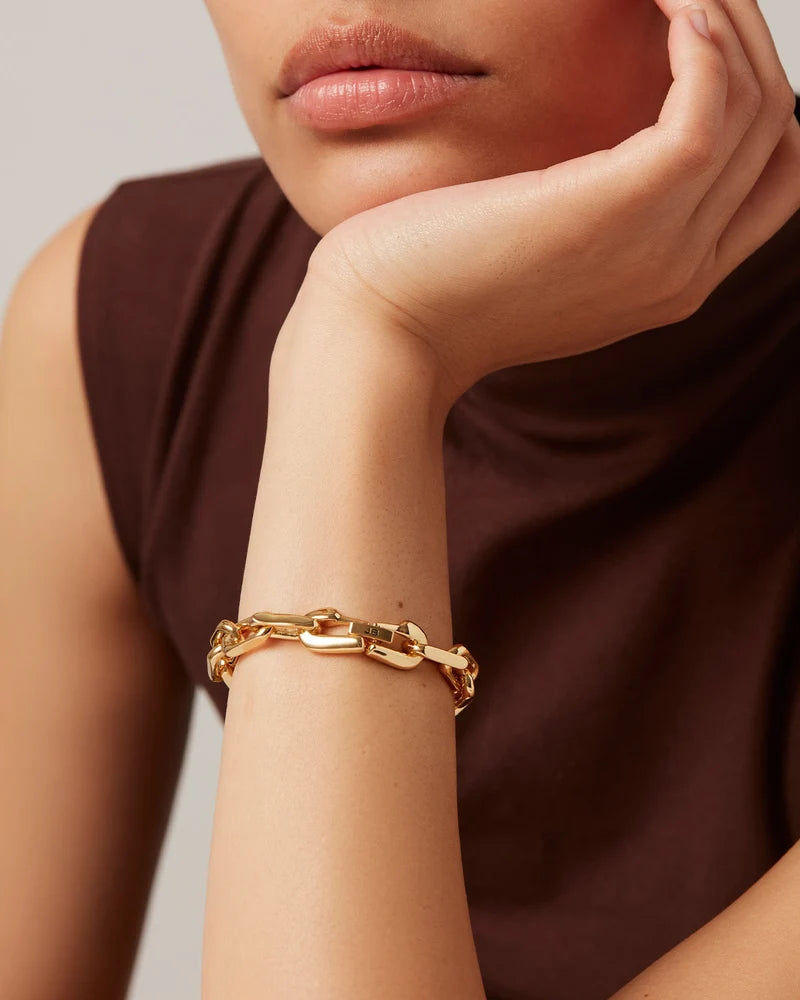 Close view of the Jenny Bird Loire gold bracelet and integrated clasp on a wrist