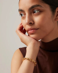 Jenny Bird Loire high-polish gold chain bracelet worn on a wrist