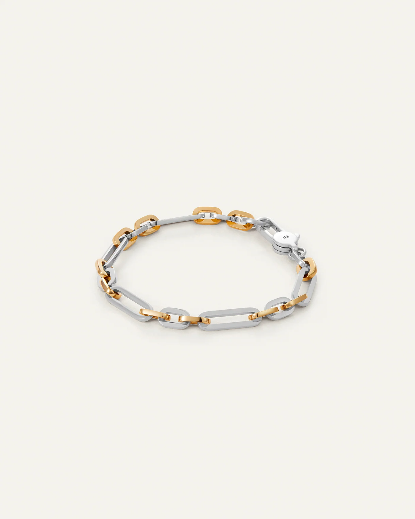 Jenny Bird Mercer Bracelet two-tone chain bracelet with silver and gold links on a light background.